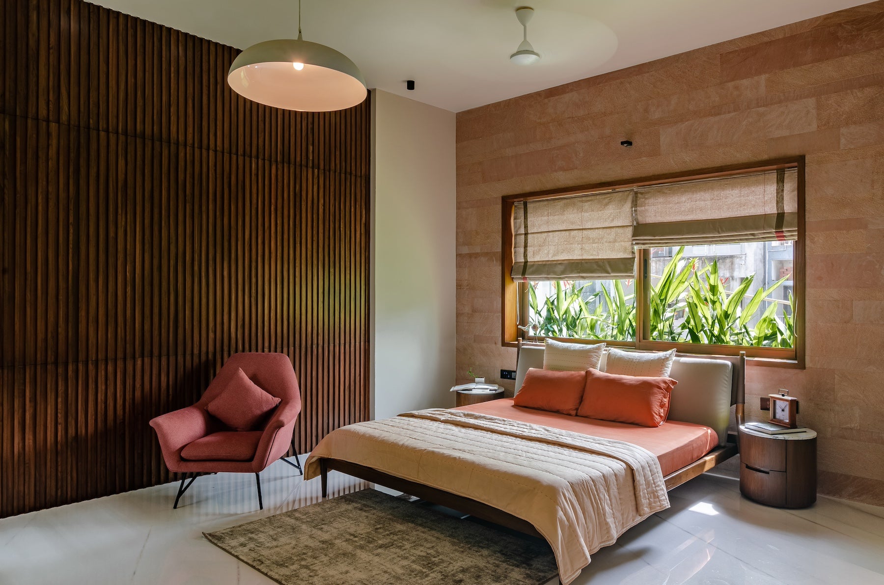 vintage master bedroom with wooden accent wall and wooden furniture with warm tones