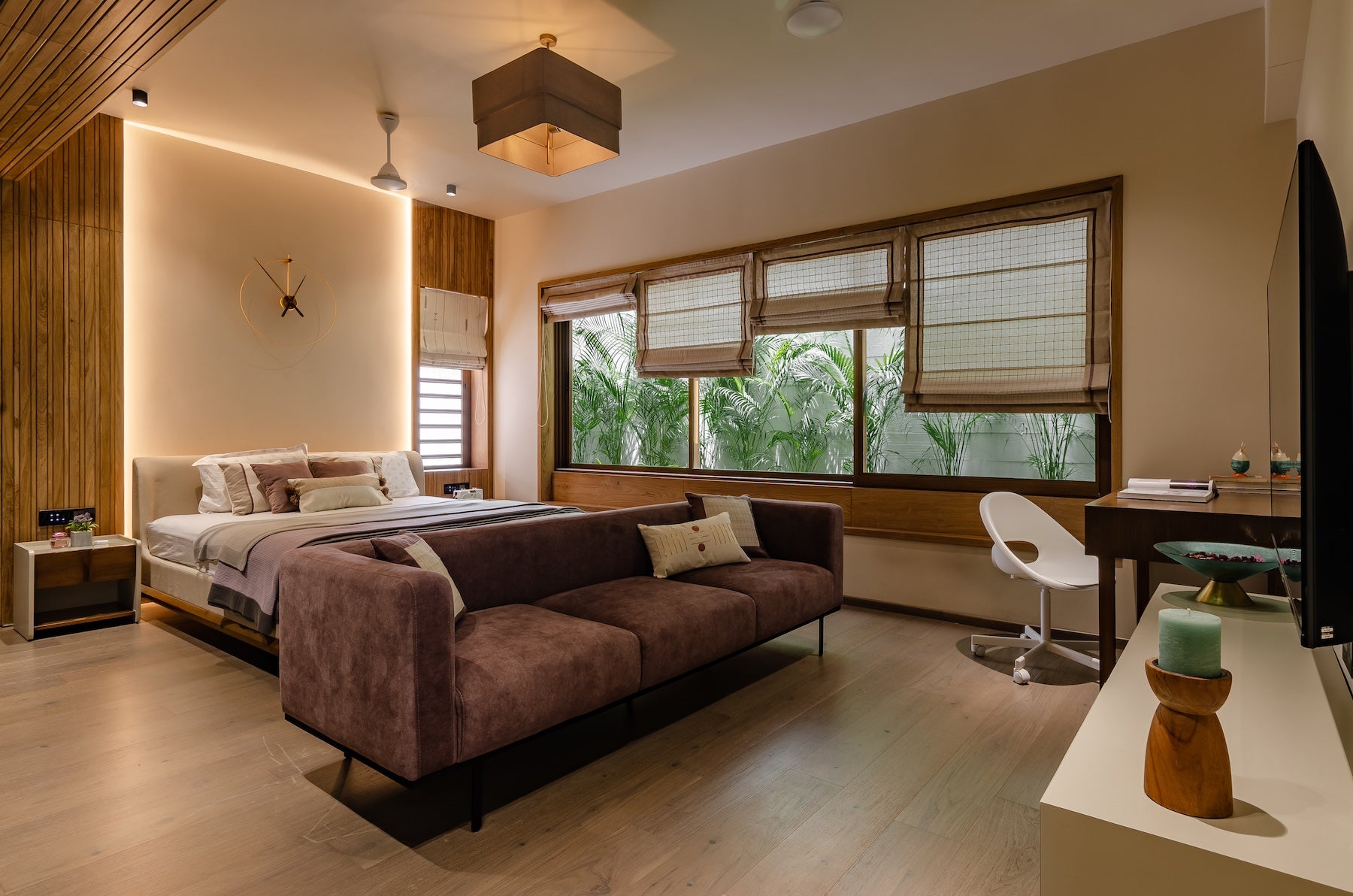 modern master bedroom interiors with custom furniture and sofa set